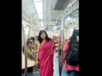 Dressed in a pink saree, Revathi Kamath shared a picture of herself inside the Metro's women's coach.