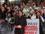 Tom Cruise posing for a picture as he attends the premiere of the film Mission: Impossible—The Final Reckoning at the Auditorio Nacional in Mexico City.