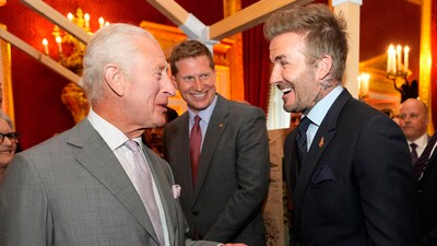 Britain's King Charles III, left speaks to former footballer David Beckham as they attend an event. (AP) Britain's King Charles III, left speaks to former footballer David Beckham as they attend an event. (AP)