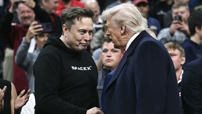 Tesla and SPaceX CEO Elon Musk (L) and US President Donald Trump shake hands as they attend the men's NCAA wrestling competition at the Wells Fargo Center in Philadelphia, Pennsylvania, on March 22, 2025. (AFP) Tesla and SPaceX CEO Elon Musk (L) and US President Donald Trump shake hands as they attend the men's NCAA wrestling competition at the Wells Fargo Center in Philadelphia, Pennsylvania, on March 22, 2025. (AFP)