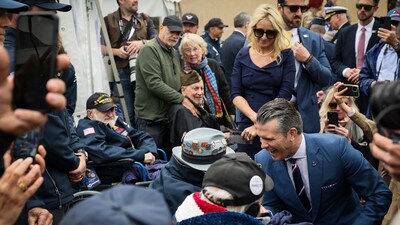 U.S. Defense Secretary Pete Hegseth and his wife, Jennifer Rauchet, met with American World War II veterans at the American Cemetery in Colleville-sur-Mer on June 6, 2025. (AP Photo/Thomas Padilla) (AP) U.S. Defense Secretary Pete Hegseth and his wife, Jennifer Rauchet, met with American World War II veterans at the American Cemetery in Colleville-sur-Mer on June 6, 2025. (AP Photo/Thomas Padilla) (AP)