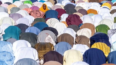A girl looks on during Eid al-Adha prayers in Kano, Nigeria, June 6, 2025. (REUTERS)