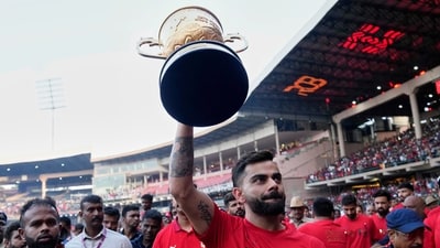 Royal Challengers Bengaluru's Virat Kohli displays the Indian Premier League winners' trophy to the fans at the M. Chinnaswamy Stadium in Bengaluru, India, Wednesday, June 4, 2025. (AP) Royal Challengers Bengaluru's Virat Kohli displays the Indian Premier League winners' trophy to the fans at the M. Chinnaswamy Stadium in Bengaluru, India, Wednesday, June 4, 2025. (AP)