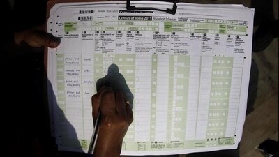 A census official collects information from a household in Guwahati in 2011. (AP) (AP)