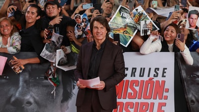 Tom Cruise posing for a picture as he attends the premiere of the film Mission: Impossible—The Final Reckoning at the Auditorio Nacional in Mexico City. (REUTERS/Henry Romero)