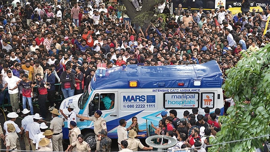 An ambulance arrives at the M Chinnaswamy Stadium as fans gather to celebrate Royal Challengers Bengaluru cricketers, winners of the Indian Premier League, in Bengaluru. (AP)