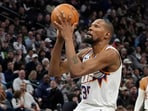 Phoenix Suns forward Kevin Durant (35) shoots against the Minnesota Timberwolves in the third quarter at Target Center