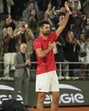 Novak Djokovic gestures to the crowd as he exits Roland Garros after losing to Jannik Sinner in the French Open semi-finals on Friday night. (AP)