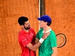 Winner Italy's Jannik Sinner cheers Serbia's Novak Djokovic (L) at the end of their men's singles semi-final match. Winner Italy's Jannik Sinner cheers Serbia's Novak Djokovic (L) at the end of their men's singles semi-final match.