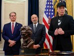 U.S. Treasury Secretary Scott Bessent and Elon Musk stand in the Oval Office during a press conference with U.S. President Donald Trump.