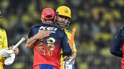 Royal Challengers Bengaluru's Virat Kohli hugs Chennai Super Kings' MS Dhoni (C) at the end of the Indian Premier League (IPL) Twenty20 cricket match between Chennai Super Kings and Royal Challengers Bengaluru (AFP)