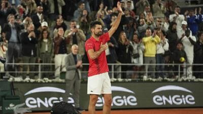 Novak Djokovic gestures to the crowd as he exits Roland Garros after losing to Jannik Sinner in the French Open semi-finals on Friday night. (AP) Novak Djokovic gestures to the crowd as he exits Roland Garros after losing to Jannik Sinner in the French Open semi-finals on Friday night. (AP)