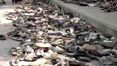 Footwears lie on the ground outside the Chinnaswamy Stadium a day after the stampede, following a large gathering of fans for the felicitation of IPL 2025 winning Royal Challengers Bengaluru team, in Bengaluru (PTI) Footwears lie on the ground outside the Chinnaswamy Stadium a day after the stampede, following a large gathering of fans for the felicitation of IPL 2025 winning Royal Challengers Bengaluru team, in Bengaluru (PTI)