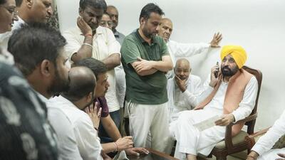 Punjab chief minister Bhagwant Mann with people protesting the police inaction in probing the Samana road accident on Saturday. (HT Photo) Punjab chief minister Bhagwant Mann with people protesting the police inaction in probing the Samana road accident on Saturday. (HT Photo)