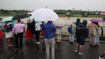 Despite the rain, fans gathered at Saratoga Race Course on June 7, 2025, to witness a thrilling race before the 157th running of the Belmont Stakes.(Photo by AL BELLO / GETTY IMAGES NORTH AMERICA / Getty Images via AFP) (Getty Images via AFP) Despite the rain, fans gathered at Saratoga Race Course on June 7, 2025, to witness a thrilling race before the 157th running of the Belmont Stakes.(Photo by AL BELLO / GETTY IMAGES NORTH AMERICA / Getty Images via AFP) (Getty Images via AFP)