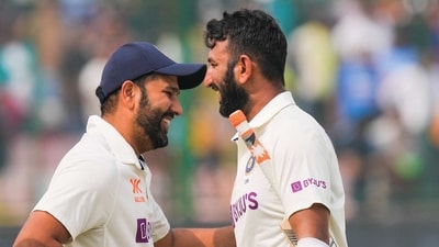 Rohit Sharma and Cheteshwar Pujara during a Test match for India. Rohit Sharma and Cheteshwar Pujara during a Test match for India.