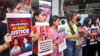Relatives and friends of Sonam Raghuvanshi, who along with her husband Raja Raghuvanshi went missing during their honeymoon in Meghalaya, stage a protest against the Meghalaya government, in Indore, Saturday. (PTI) Relatives and friends of Sonam Raghuvanshi, who along with her husband Raja Raghuvanshi went missing during their honeymoon in Meghalaya, stage a protest against the Meghalaya government, in Indore, Saturday. (PTI)