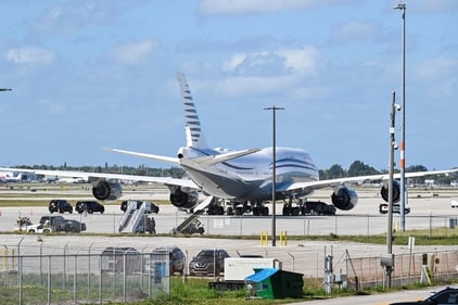 In this February 15, 2025 photo the motorcade of US President Donald Trump is parked next to an almost 13 year old Boeing 747 sitting on the tarmac of Palm Beach International airport on February 15, 2025. Donald Trump accepted the luxury Boeing jet from the Qatari royal family with plans to use it as Air Force One and then continue flying in it after his tenure, (AFP) In this February 15, 2025 photo the motorcade of US President Donald Trump is parked next to an almost 13 year old Boeing 747 sitting on the tarmac of Palm Beach International airport on February 15, 2025. Donald Trump accepted the luxury Boeing jet from the Qatari royal family with plans to use it as Air Force One and then continue flying in it after his tenure, (AFP)