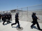 Law enforcement officers are seen during a protest against federal immigration sweeps in Los Angeles