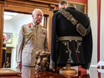 In this pic, Britain's King Charles, as Captain General, of the Royal Artillery looks at the artillery uniform of his ancestor King George V.