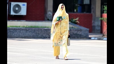 A woman takes cover from the scorching sun in Chandigarh. (Ravi Kumar/HT) A woman takes cover from the scorching sun in Chandigarh. (Ravi Kumar/HT)