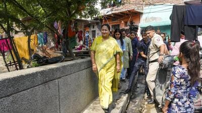 Delhi chief minister Rekha Gupta at Nehru Camp JJ Cluster in New Delhi on Sunday. (PTI)