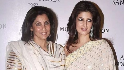 In another look with daughter Twinkle, Dimple wows in a white suit adorned with silver and gold stripes, styled with dangling earrings and soft, loose tresses. (Instagram) In another look with daughter Twinkle, Dimple wows in a white suit adorned with silver and gold stripes, styled with dangling earrings and soft, loose tresses. (Instagram)