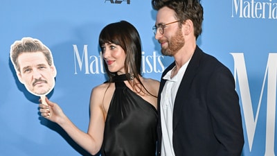 The two even shared sweet moments with the Pedro stand-in while posing for the cameras before heading into the theatre. (Evan Agostini/Invision/AP)