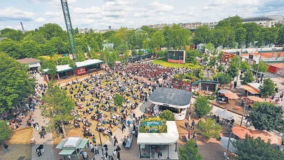 People watch a TV screen outside the center court Philippe-Chatrier during the final match of the French Open on Sunday. (AP) People watch a TV screen outside the center court Philippe-Chatrier during the final match of the French Open on Sunday. (AP)