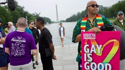 At the WorldPride International Rally and March on Washington for Freedom on June 8, 2025, a man stood proudly at the Lincoln Memorial holding a sign that read "Gay is good." (Photo by Amid FARAHI / AFP) (AFP)