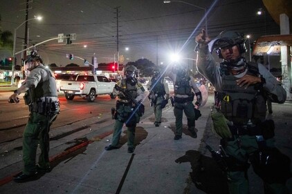 A Los Angeles Sheriff Department officer prepares to shoot a tear gas bomb at protesters during an immigration protest on June 7, 2025, in Paramount, California. (AFP) A Los Angeles Sheriff Department officer prepares to shoot a tear gas bomb at protesters during an immigration protest on June 7, 2025, in Paramount, California. (AFP)