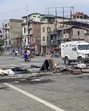 A road is blocked by residents amid ongoing protests near Imphal on Monday. (PTI)