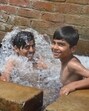 Amid rising temperature, youths take a bath in an Amritsar village on Monday. (Sameer Sehgal/HT) Amid rising temperature, youths take a bath in an Amritsar village on Monday. (Sameer Sehgal/HT)