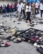 People stand next to abandoned shoes and a fallen barrier following a stampede outside the M Chinnaswamy Stadium in Bengaluru on June 4. At least 11 people were killed in a stampede; (right) At the New Delhi Railway station where a stampede broke out after a huge crowd devotees tried to board two Prayagraj-bound that arrived around the same time, in February. (AFP)