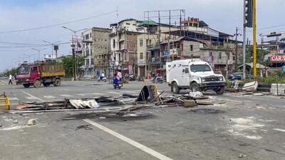 A road is blocked by residents amid ongoing protests near Imphal on Monday. (PTI) A road is blocked by residents amid ongoing protests near Imphal on Monday. (PTI)