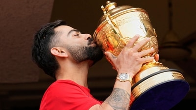Royal Challengers Bengaluru's Virat Kohli kisses the winners' trophy after his team won the IPL for the first time in 18 years. (AP) Royal Challengers Bengaluru's Virat Kohli kisses the winners' trophy after his team won the IPL for the first time in 18 years. (AP)