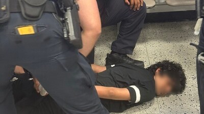 An Indian man was handcuffed and pinned to the ground at USA's Newark Airport (X/@SONOFINDIA) An Indian man was handcuffed and pinned to the ground at USA's Newark Airport (X/@SONOFINDIA)
