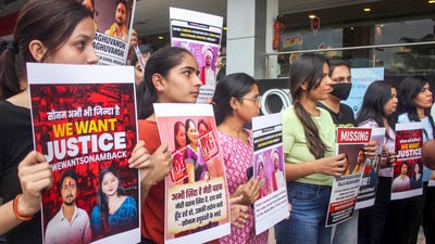 File photo of relatives and friends of Sonam Raghuvanshi holding protest in Indore when she was missing from her honeymoon with her now-dead husband Raja Raghuvanshi in Meghalaya (PTI/File) File photo of relatives and friends of Sonam Raghuvanshi holding protest in Indore when she was missing from her honeymoon with her now-dead husband Raja Raghuvanshi in Meghalaya (PTI/File)