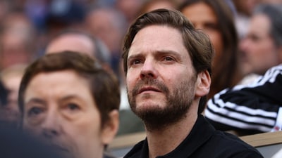 Actor Daniel Bruhl in the stands during the semi final match between Serbia's Novak Djokovic and Italy's Jannik Sinner. (REUTERS)