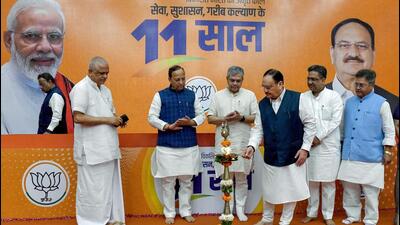 Union minister and BJP national president JP Nadda lights a lamp at an exhibition on completion of 11 years of Prime Minister Narendra Modi-led NDA government, at BJP HQ in New Delhi on Monday. (ANI) Union minister and BJP national president JP Nadda lights a lamp at an exhibition on completion of 11 years of Prime Minister Narendra Modi-led NDA government, at BJP HQ in New Delhi on Monday. (ANI)