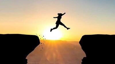 Woman jumping over abyss in fornt of sunset. (Getty Images/iStockphoto) Woman jumping over abyss in fornt of sunset. (Getty Images/iStockphoto)