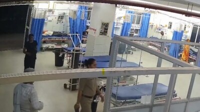 CCTV footage from the Ghazipur Medical College, where Sonam Raghuvanshi was brought after her arrest, showed her being accompanied by police personnel, seemingly shaken and lumbering. (PTI) CCTV footage from the Ghazipur Medical College, where Sonam Raghuvanshi was brought after her arrest, showed her being accompanied by police personnel, seemingly shaken and lumbering. (PTI)