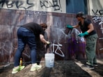 Social activists and artists take graffiti off from the Japanese American National Museum