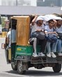 People seen covering heads and faces to protect themselveson a hot summer day in Gurugram on Tuesday. (Parveen Kumar/Hindustan Times)