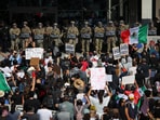 Demonstrators stand in front of California National Guard troops, as protests against immigration sweeps continue, in Los Angeles, California, US June 9, 2025.  