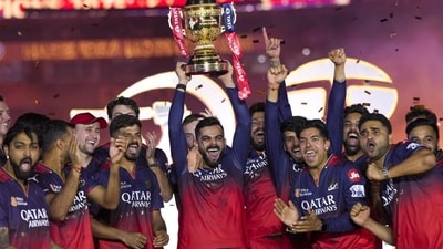 Royal Challengers Bengaluru’s Virat Kohli lifts the championship trophy as captain Rajat Patidar and others celebrate (PTI) Royal Challengers Bengaluru’s Virat Kohli lifts the championship trophy as captain Rajat Patidar and others celebrate (PTI)
