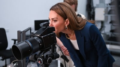 Kate Middleton looks through the viewfinder of a camera in the photographic studio during a visit to the V&A East Storehouse, a brand-new cultural destination in East London, on June 10, 2025. (AFP) Kate Middleton looks through the viewfinder of a camera in the photographic studio during a visit to the V&A East Storehouse, a brand-new cultural destination in East London, on June 10, 2025. (AFP)