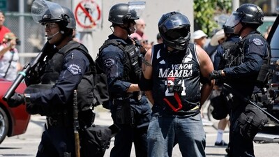 A protestor is arrested by LAPD officers on June 08, 2025 in Los Angeles, California. (Getty Images via AFP) A protestor is arrested by LAPD officers on June 08, 2025 in Los Angeles, California. (Getty Images via AFP)