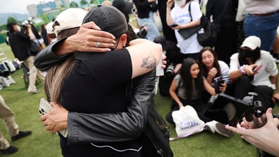 Fans react after BTS members V and RM, who have been discharged from South Korea’s mandatory military service, left an event in Chuncheon, South Korea, June 10, 2025. REUTERS/Kim Hong-Ji (REUTERS)