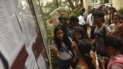 Mumbai, India - July 12, 2019: Students and parents check the first merit list of FYJC, put up outside H R college at Churchgate in Mumbai, India, on Friday, July 12, 2019. (Photo by Anshuman Poyrekar/Hindustan Times) (Anshuman Poyrekar/HT Photo) Mumbai, India - July 12, 2019: Students and parents check the first merit list of FYJC, put up outside H R college at Churchgate in Mumbai, India, on Friday, July 12, 2019. (Photo by Anshuman Poyrekar/Hindustan Times) (Anshuman Poyrekar/HT Photo)